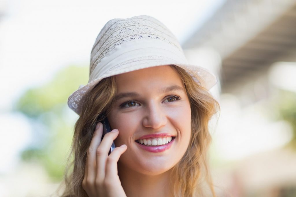 woman happily talking on phone